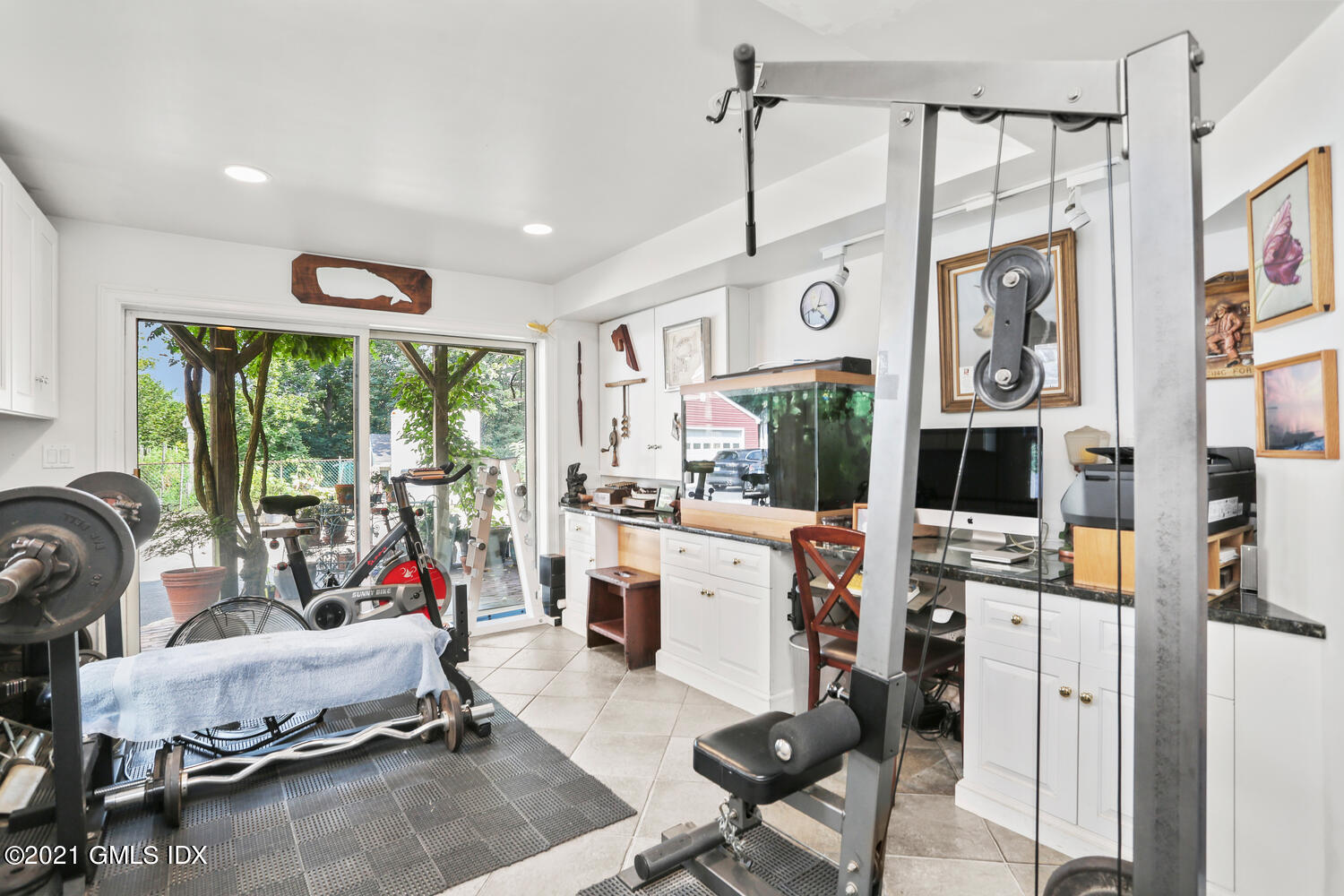 45 Rodwell Avenue Greenwich, CT 06830 - Photo 23 of 42 a room with gym equipment and a large window