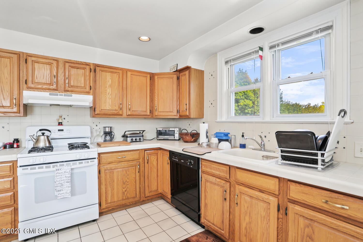 45 Rodwell Avenue Greenwich, CT 06830 - Photo 26 of 42 a kitchen with a sink stove and window