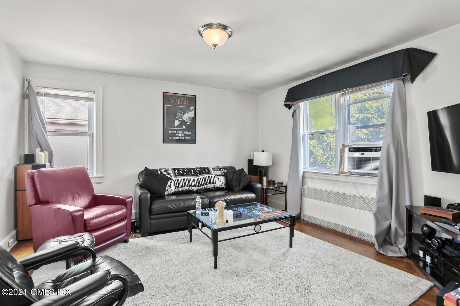 45 Rodwell Avenue Greenwich, CT 06830 - Photo 28 of 42 a living room with furniture a flat screen tv and a window