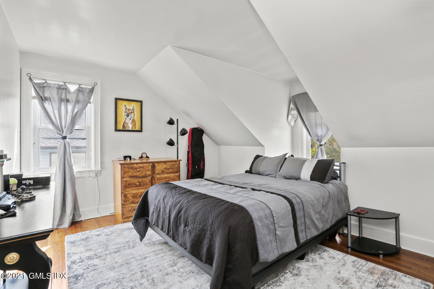 45 Rodwell Avenue Greenwich, CT 06830 - Photo 30 of 42 a bedroom with a bed and a table in it