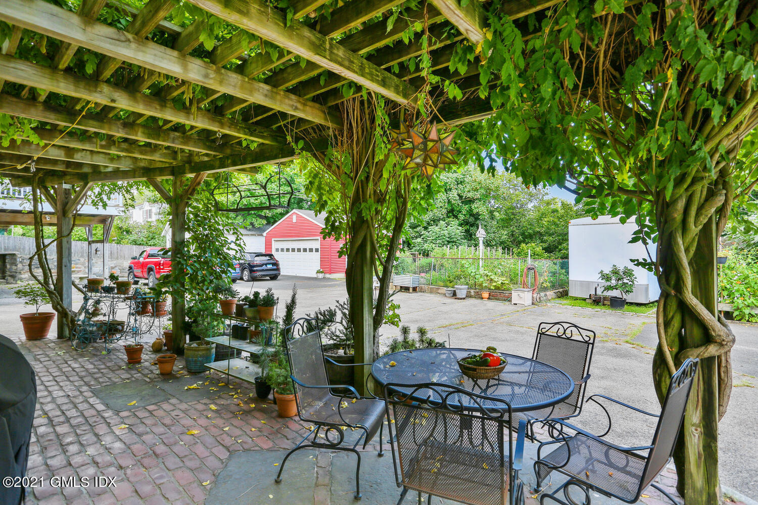 45 Rodwell Avenue Greenwich, CT 06830 - Photo 32 of 42 a backyard of a house with seating space