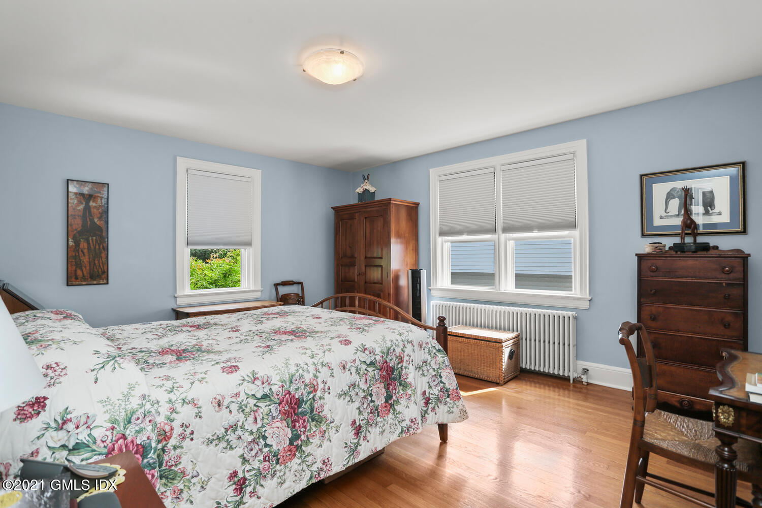45 Rodwell Avenue Greenwich, CT 06830 - Photo 9 of 42 a bedroom with a bed and wooden floor