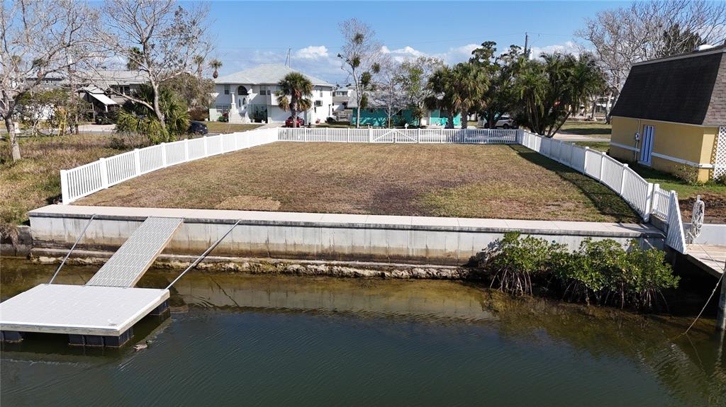 a swimming pool with outdoor seating and yard