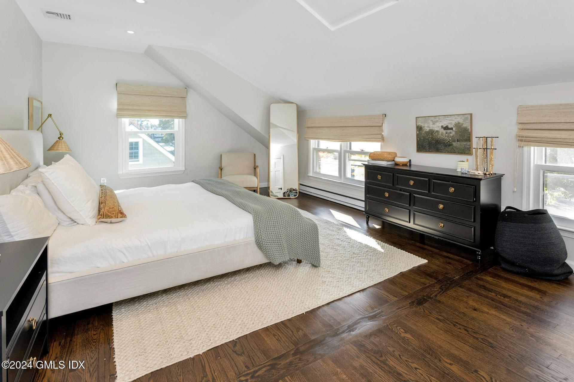 25 Bible Street, Unit 2 Cos Cob, CT 06807 - Photo 13 of 24 a bedroom with a bed and window