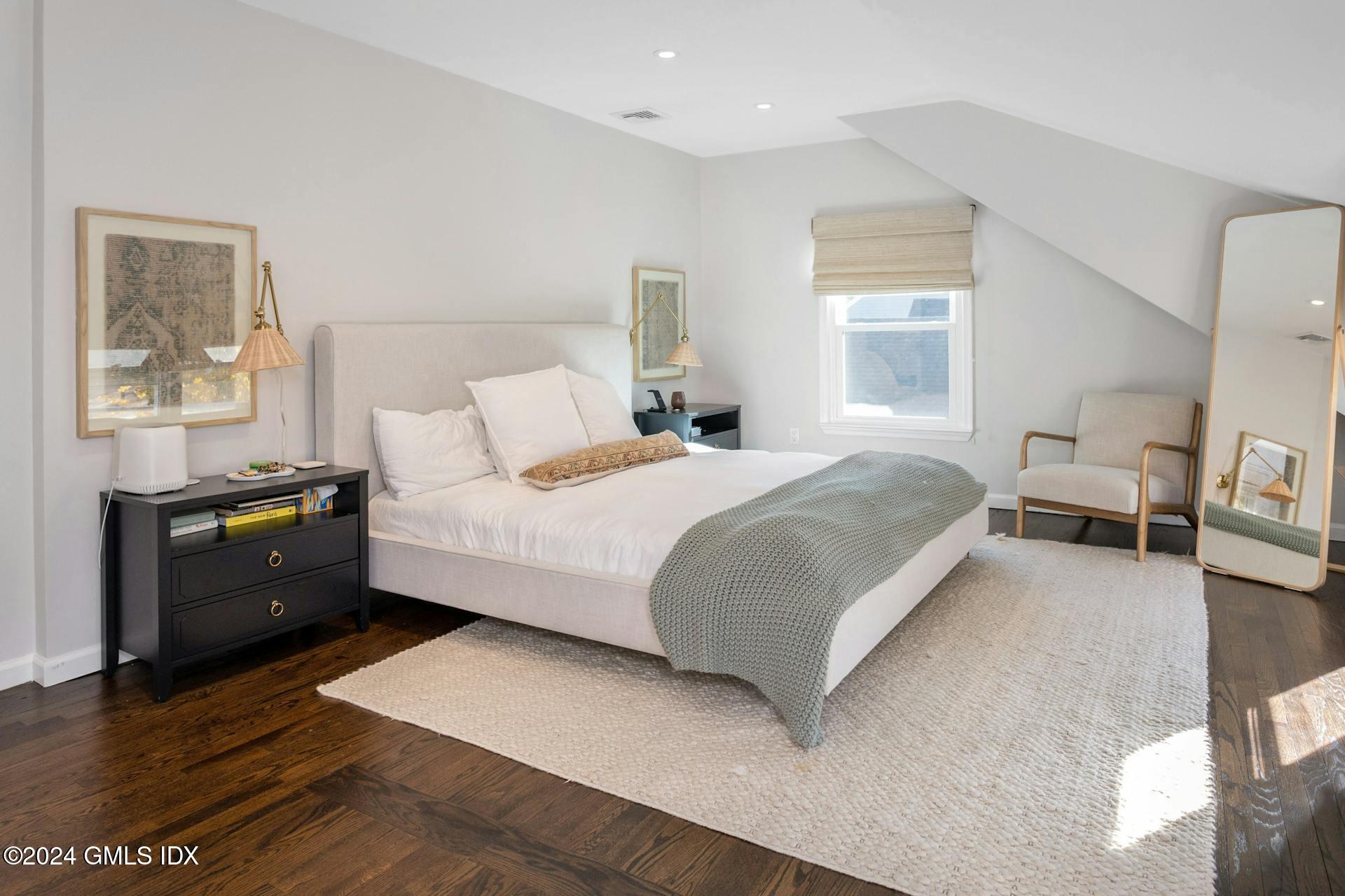 25 Bible Street, Unit 2 Cos Cob, CT 06807 - Photo 14 of 24 a bedroom with a bed and a couch