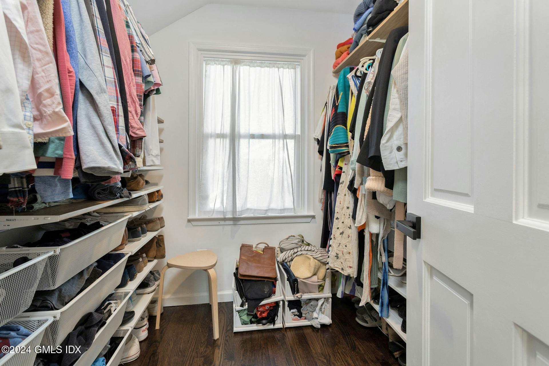 25 Bible Street, Unit 2 Cos Cob, CT 06807 - Photo 15 of 24 a view of walk in closet with clothes and shoes