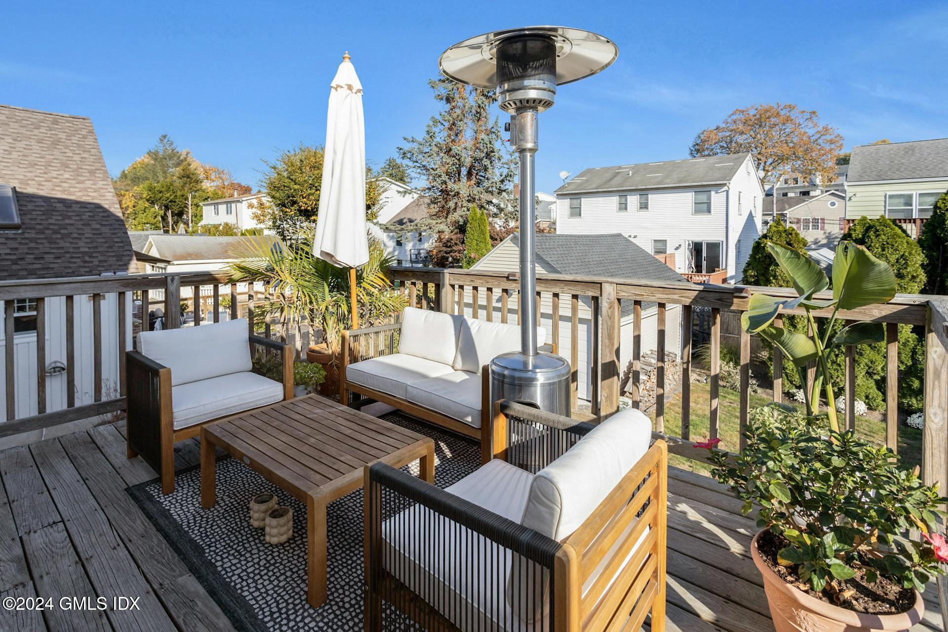 25 Bible Street, Unit 2 Cos Cob, CT 06807 - Photo 20 of 24 a view of a chairs and table in the balcony