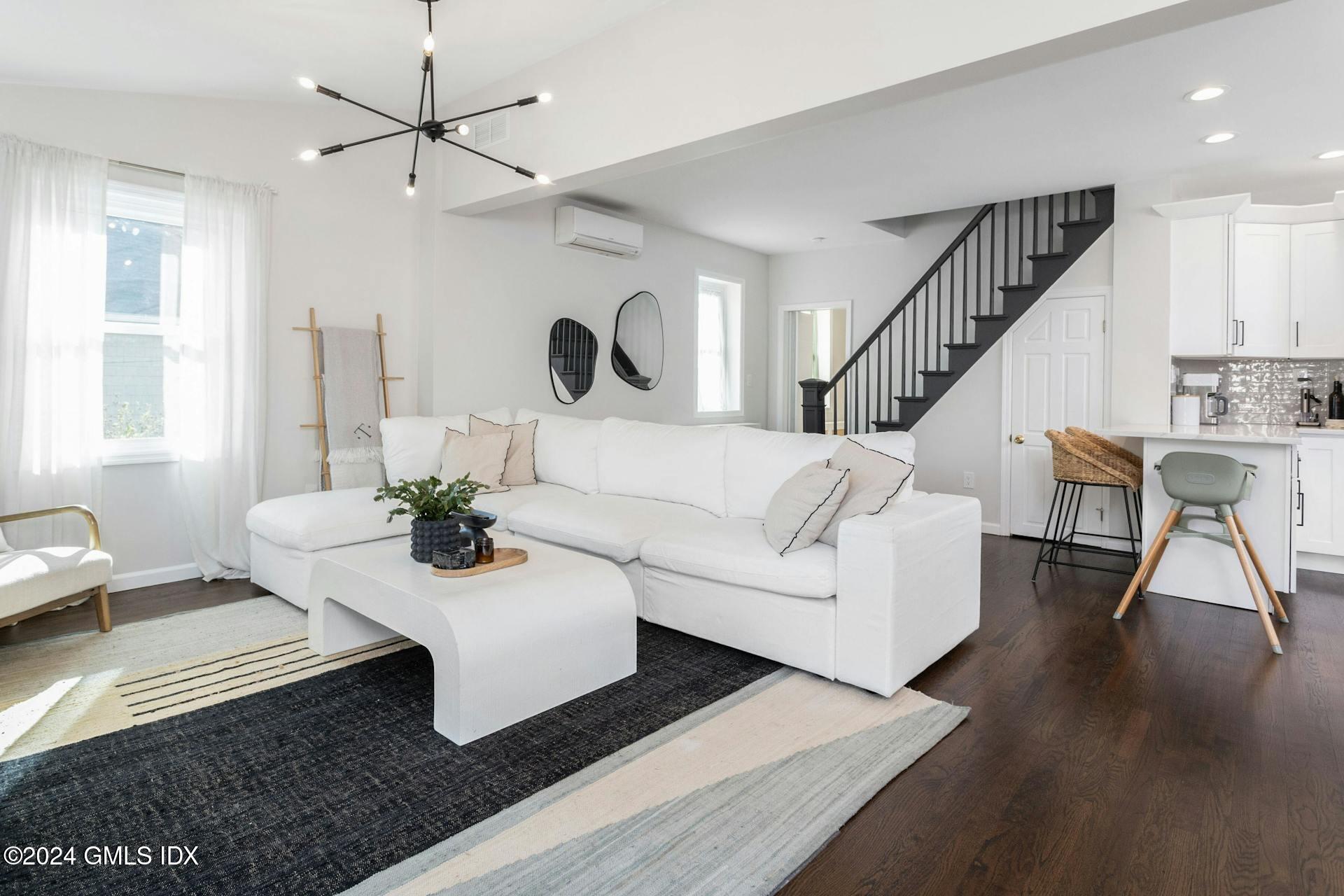 25 Bible Street, Unit 2 Cos Cob, CT 06807 - Photo 2 of 24 a living room with furniture and a large window
