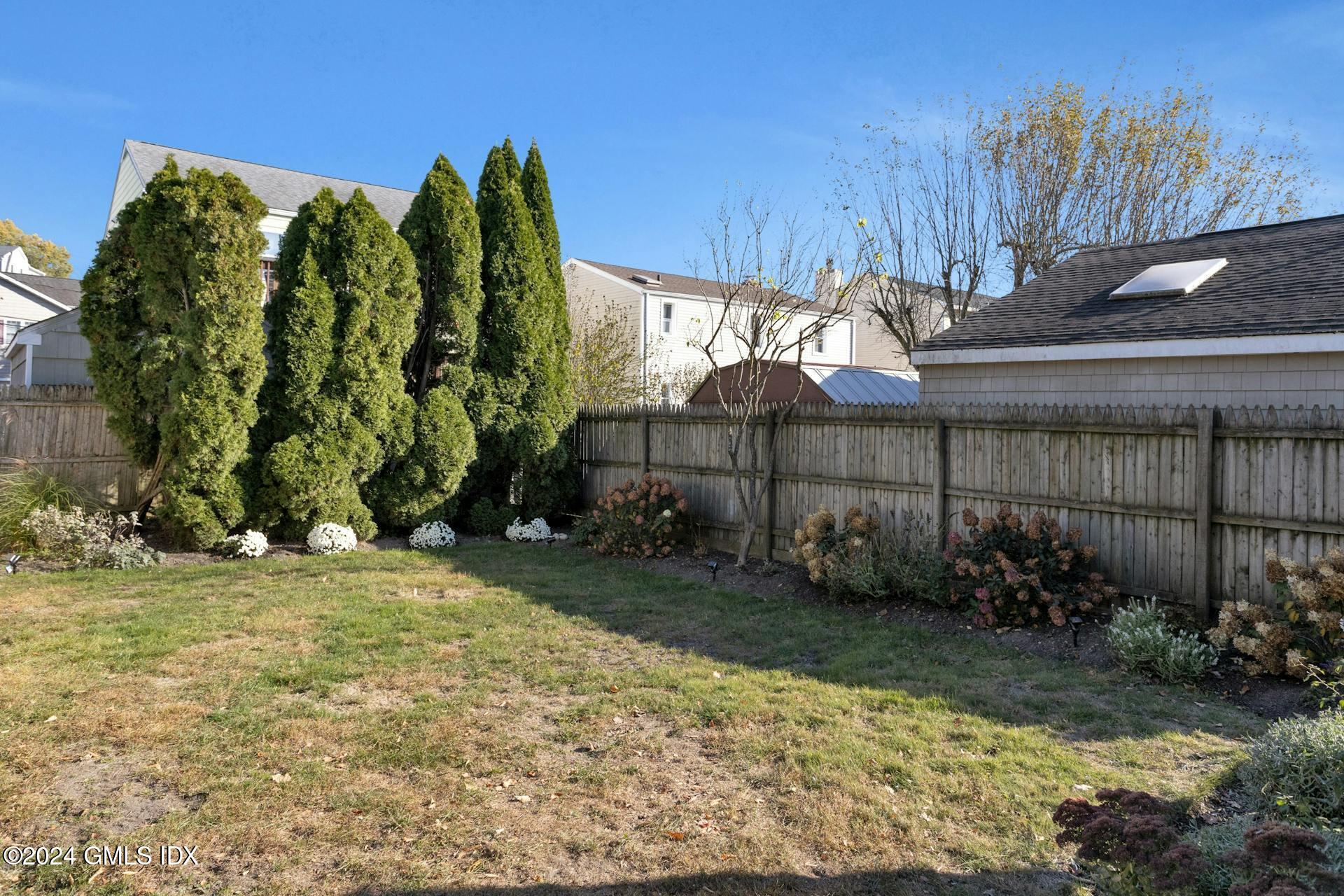 25 Bible Street, Unit 2 Cos Cob, CT 06807 - Photo 22 of 24 a view of a backyard