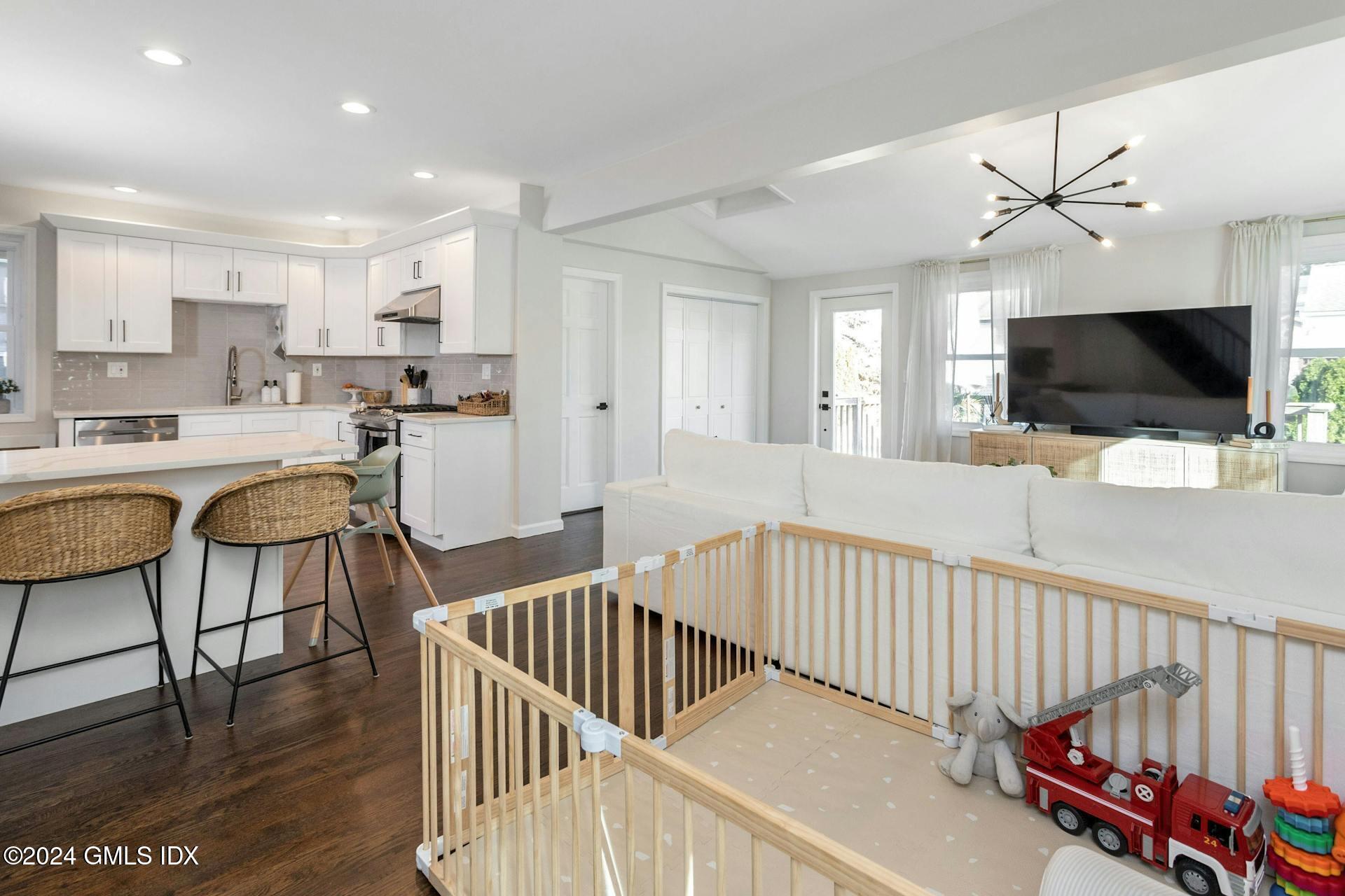25 Bible Street, Unit 2 Cos Cob, CT 06807 - Photo 10 of 24 a living room with furniture and a flat screen tv