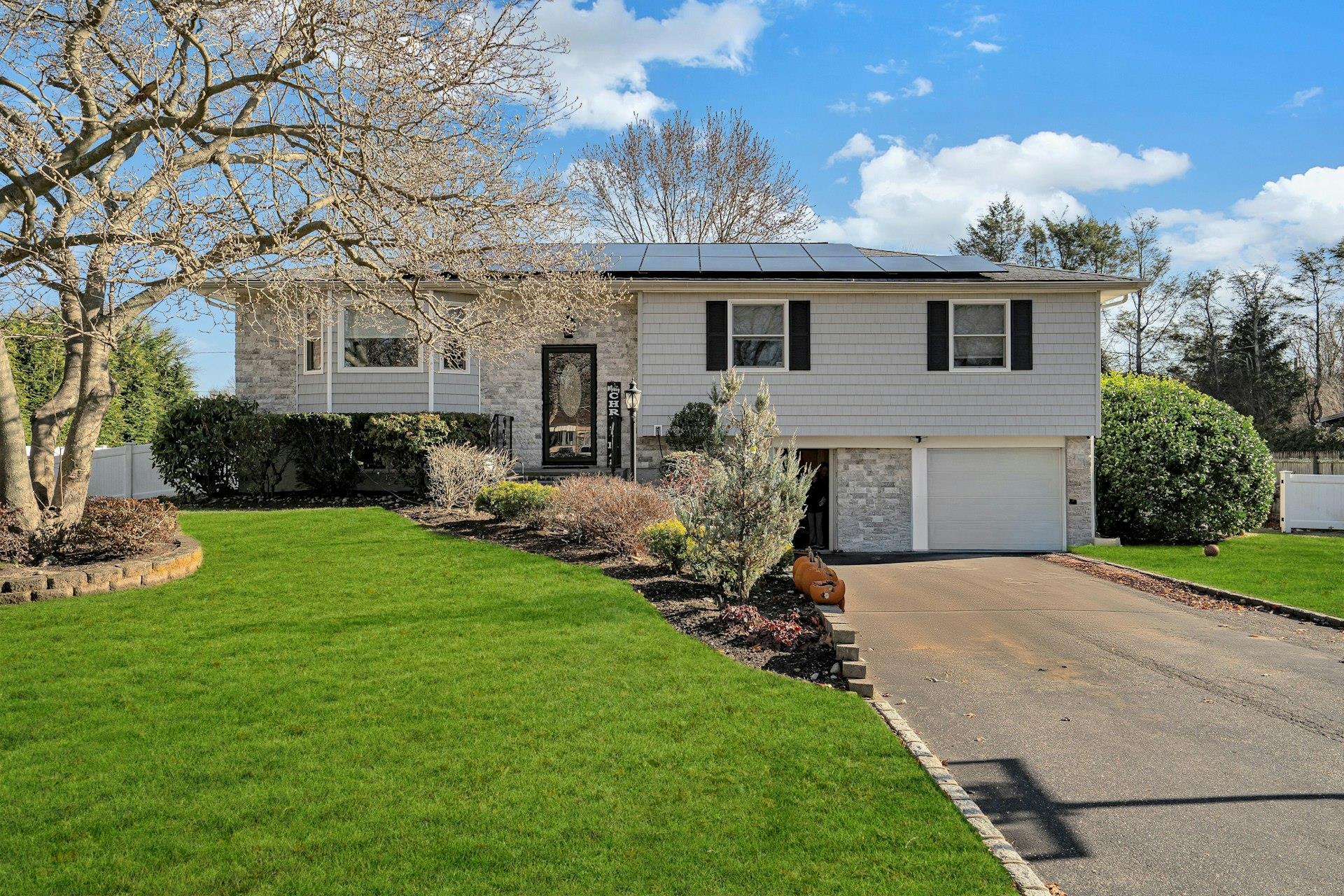 127 Wicks Path Commack, NY 11725 - Photo 1 of 1 a front view of house with yard and outdoor seating