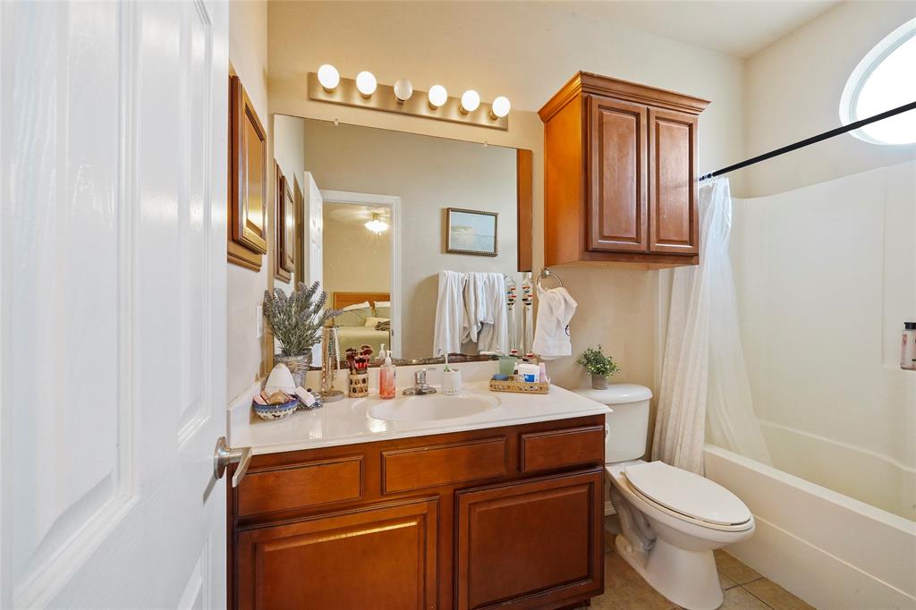 1198 Jones-Butler Road, Unit 203 College Station, TX 77840 - Photo 15 of 18 Full bath featuring vanity, light tile patterned floors, and shower / tub combo