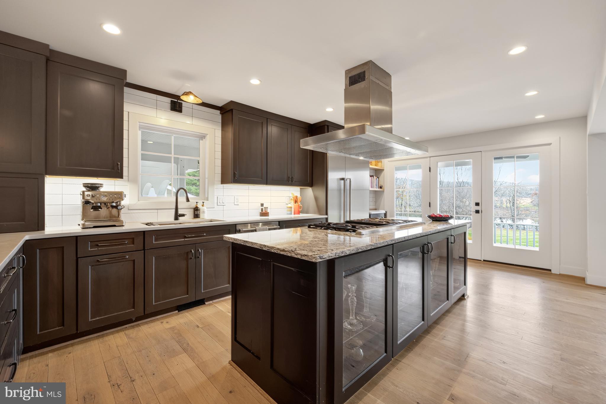 37896 Legard Farm Road Purcellville, VA 20132 - Photo 23 of 117 a kitchen with stainless steel appliances granite countertop a sink and a stove