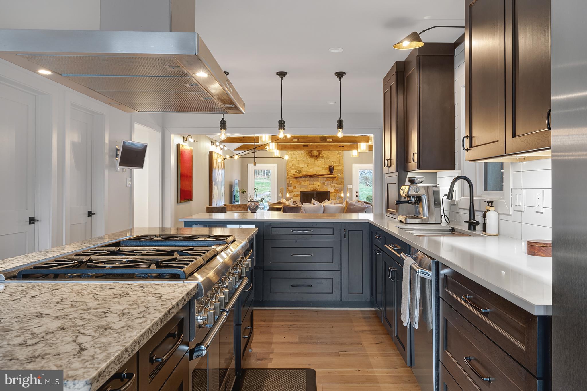 37896 Legard Farm Road Purcellville, VA 20132 - Photo 27 of 117 a kitchen with stainless steel appliances granite countertop a sink stove and refrigerator