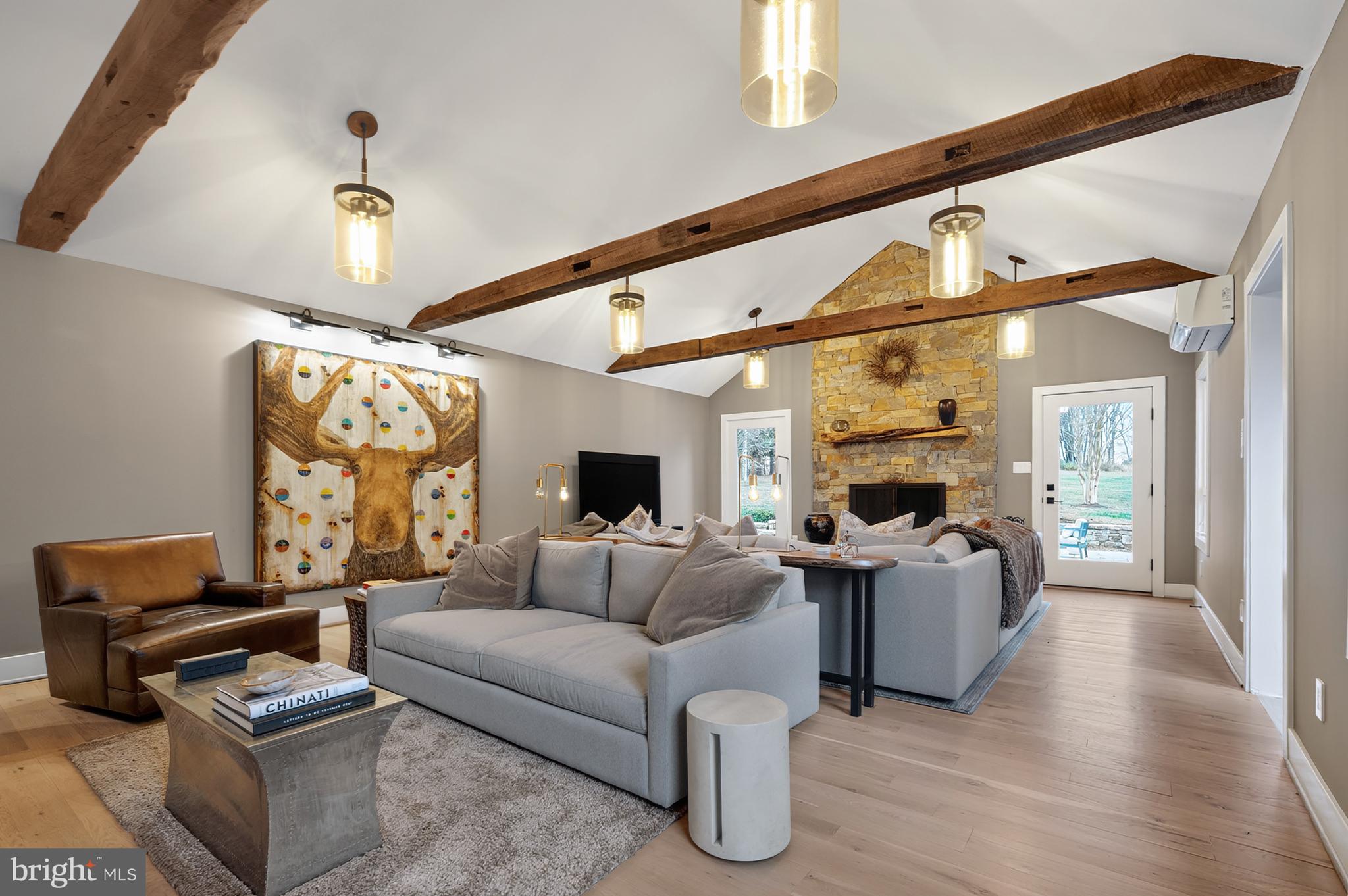 37896 Legard Farm Road Purcellville, VA 20132 - Photo 29 of 117 a living room with furniture and a chandelier