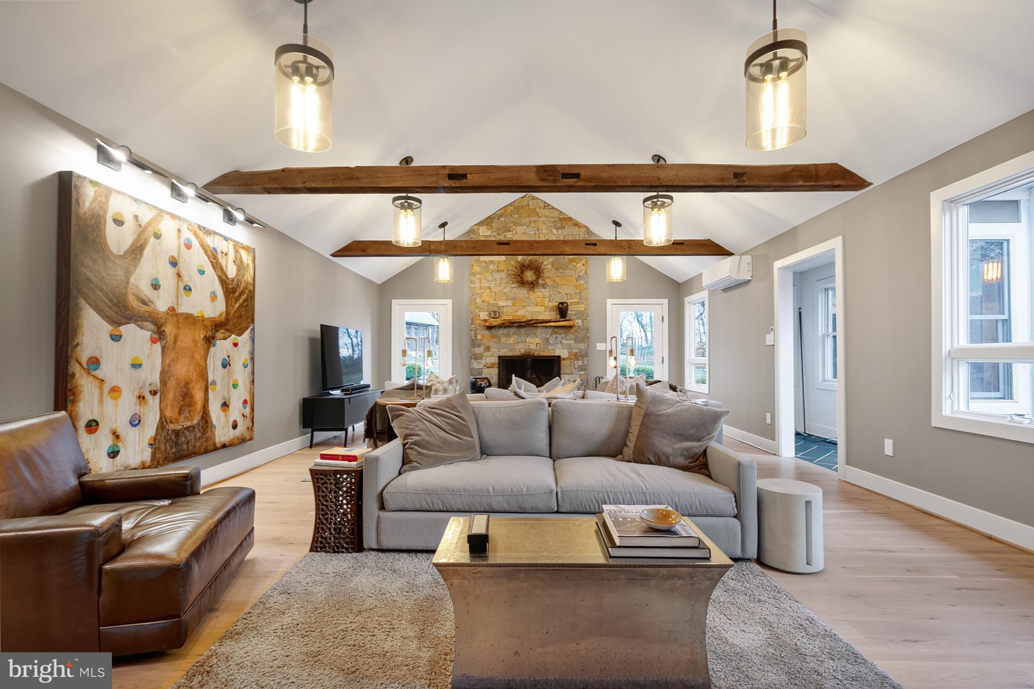 37896 Legard Farm Road Purcellville, VA 20132 - Photo 30 of 117 a living room with furniture and a chandelier