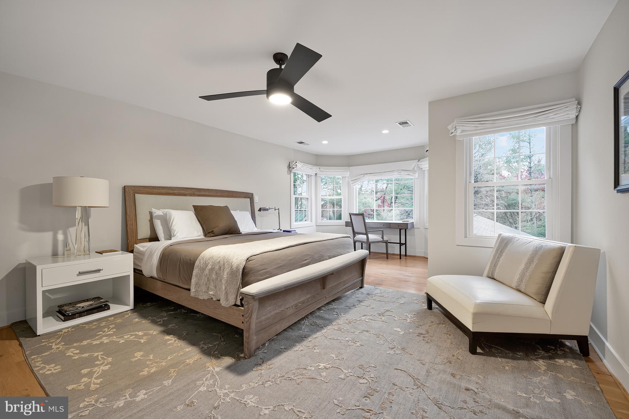 37896 Legard Farm Road Purcellville, VA 20132 - Photo 61 of 117 a spacious bedroom with a bed and ceiling fan