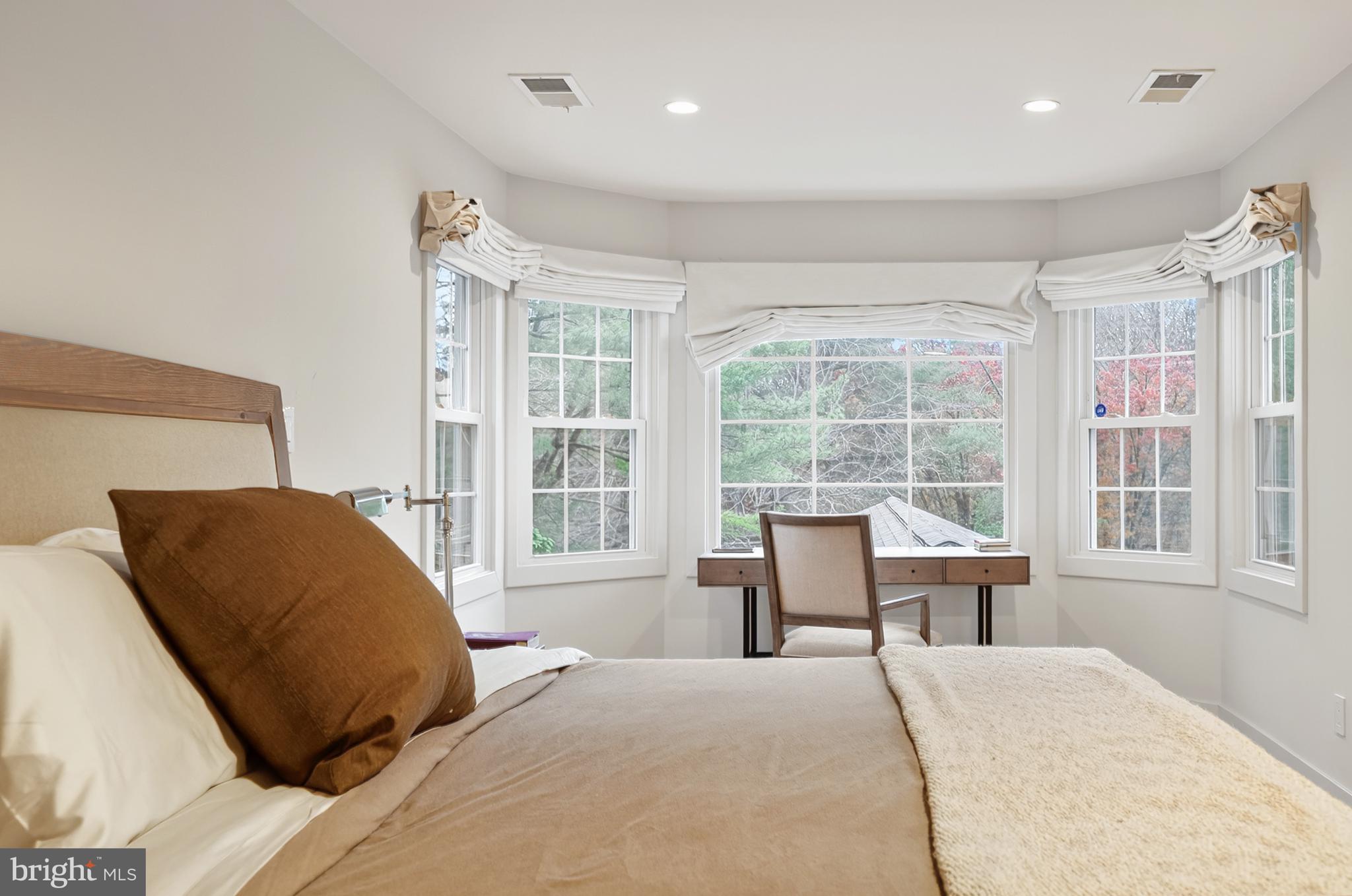 37896 Legard Farm Road Purcellville, VA 20132 - Photo 62 of 117 a bedroom with a large bed and a large window
