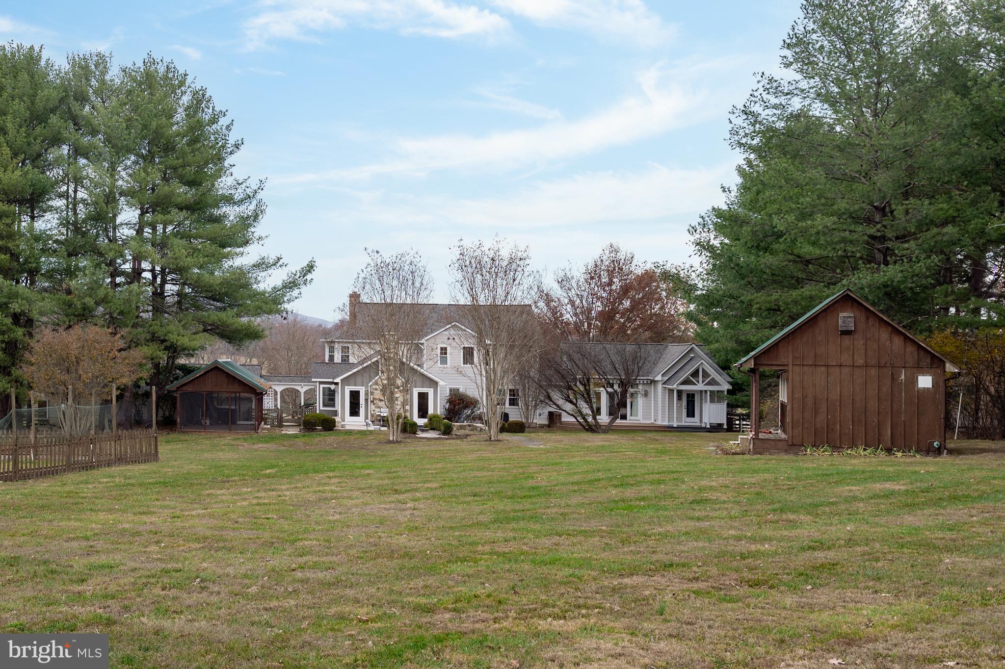 37896 Legard Farm Road Purcellville, VA 20132 - Photo 86 of 117 a view of a house with garden and trees