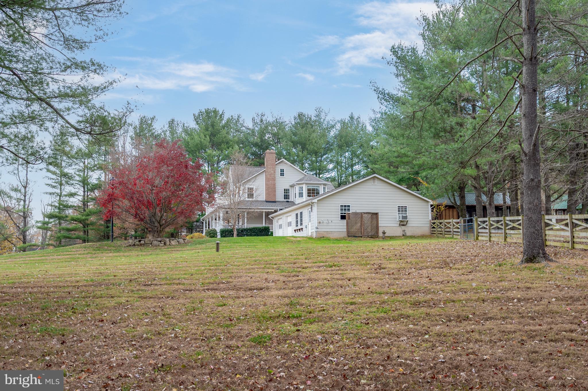 37896 Legard Farm Road Purcellville, VA 20132 - Photo 88 of 117 a large house with a big yard and large trees