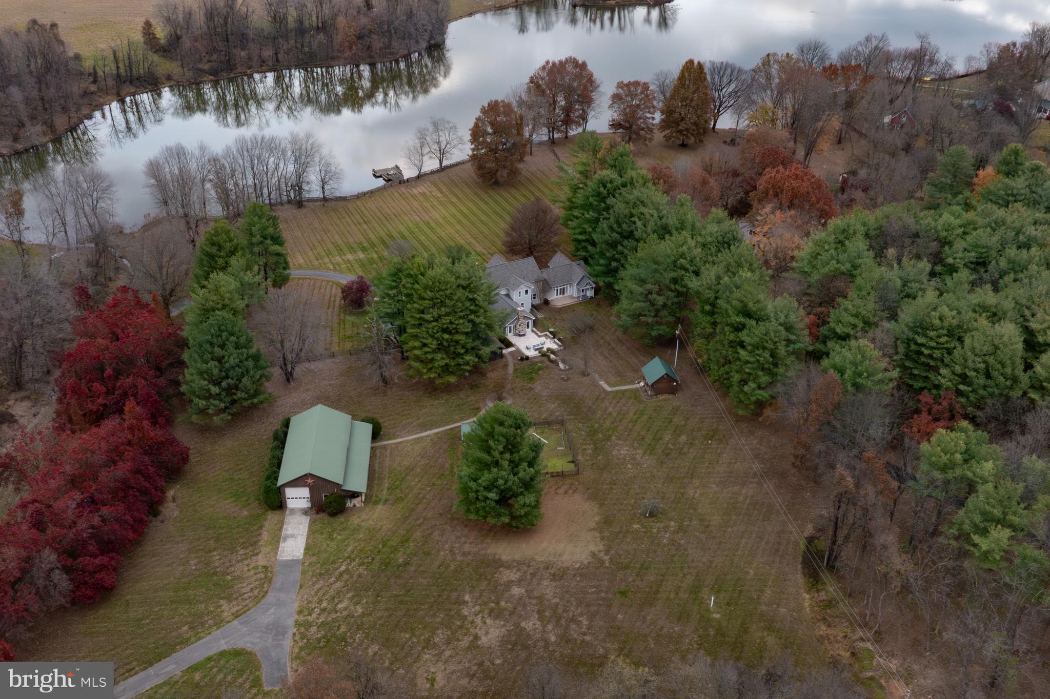 37896 Legard Farm Road Purcellville, VA 20132 - Photo 98 of 117 an aerial view of a house with a yard and lake view