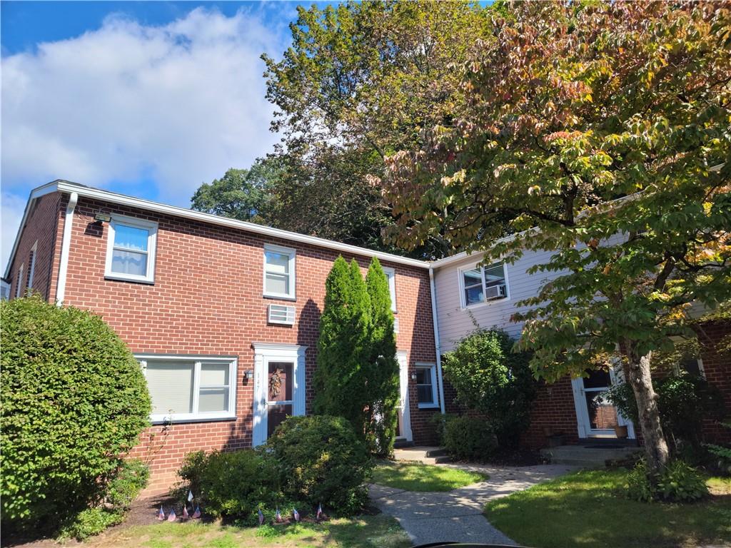 149 Charter Circle, Unit 149 Ossining, NY 10562 - Photo 1 of 1 a front view of a house with garden