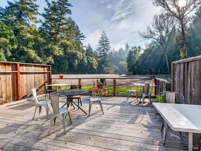 an aerial view of residential house with outdoor space and parking