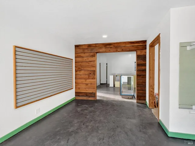 a backyard of a house with garden and outdoor seating