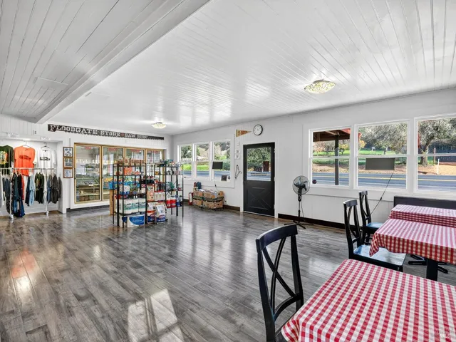 a room with lots of wooden furniture and a window