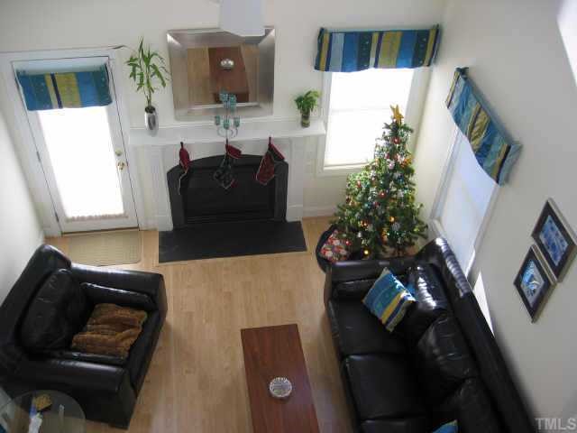 5001 Village Drive Raleigh, NC 27613 - Photo 3 of 8 a living room with furniture and a potted plant