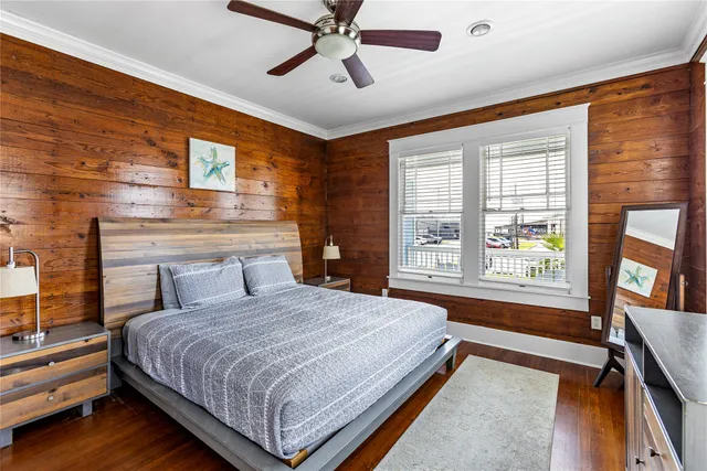 a bedroom with a bed couch and window