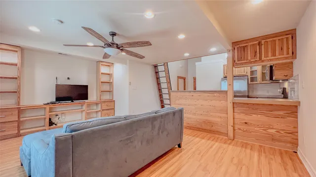 a kitchen with kitchen island granite countertop a stove and a sink