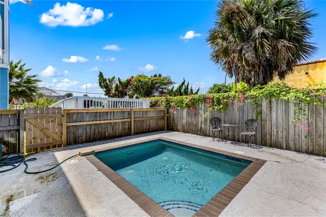 a view of a backyard with large trees