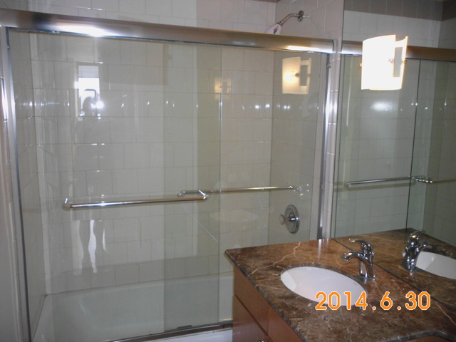 655 West Irving Park Road, Unit 4910 Chicago, IL 60613 - Photo 11 of 22 a bathroom with a sink double vanity and shower