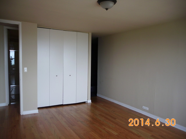 655 West Irving Park Road, Unit 4910 Chicago, IL 60613 - Photo 15 of 22 a view of an empty room and window