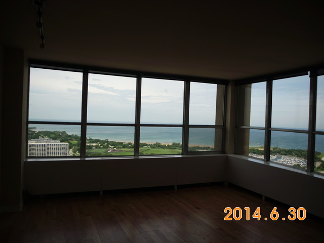 655 West Irving Park Road, Unit 4910 Chicago, IL 60613 - Photo 4 of 22 a view of an empty room with a window