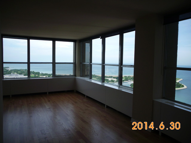 655 West Irving Park Road, Unit 4910 Chicago, IL 60613 - Photo 5 of 22 a view of an empty room with a window
