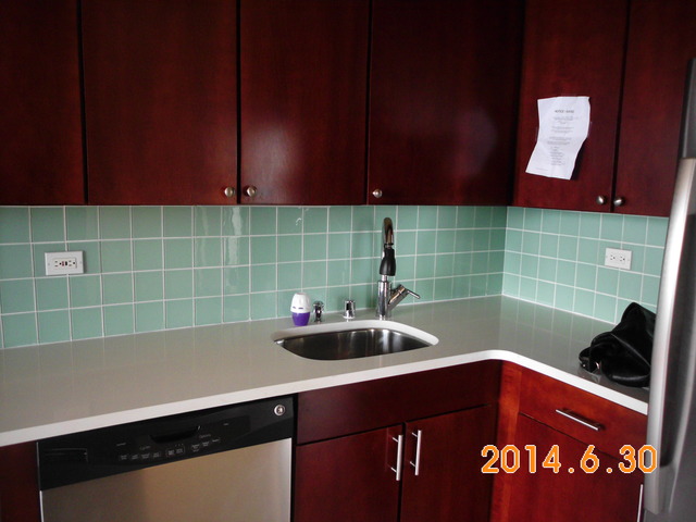 655 West Irving Park Road, Unit 4910 Chicago, IL 60613 - Photo 9 of 22 a bathroom with a sink and a bathtub