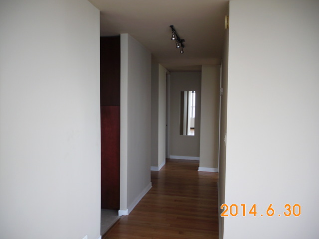 655 West Irving Park Road, Unit 4910 Chicago, IL 60613 - Photo 10 of 22 a view of a hallway with wooden floor