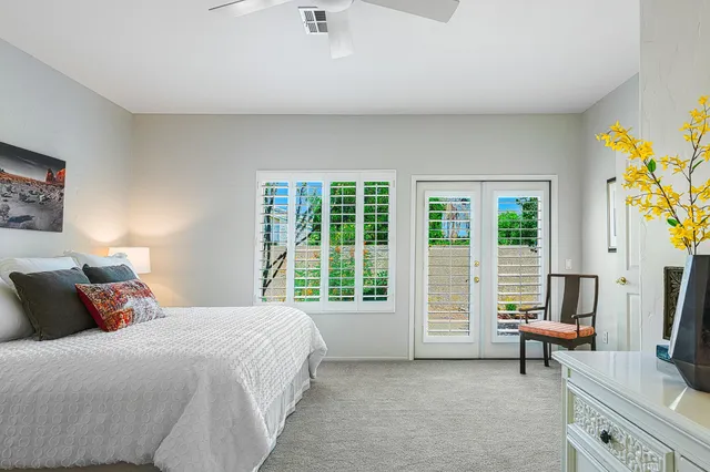 a kitchen with a sink refrigerator and wooden floor