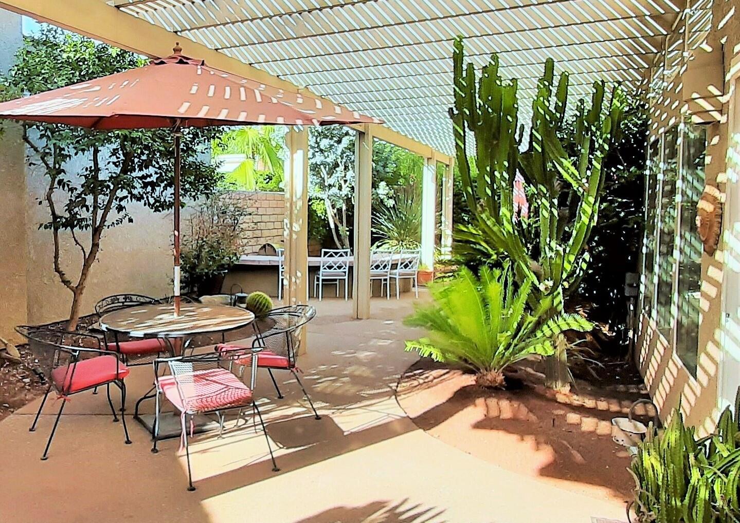 7 Florentina Drive Rancho Mirage, CA 92270 - Photo 21 of 45 a view of a backyard with sitting area and furniture