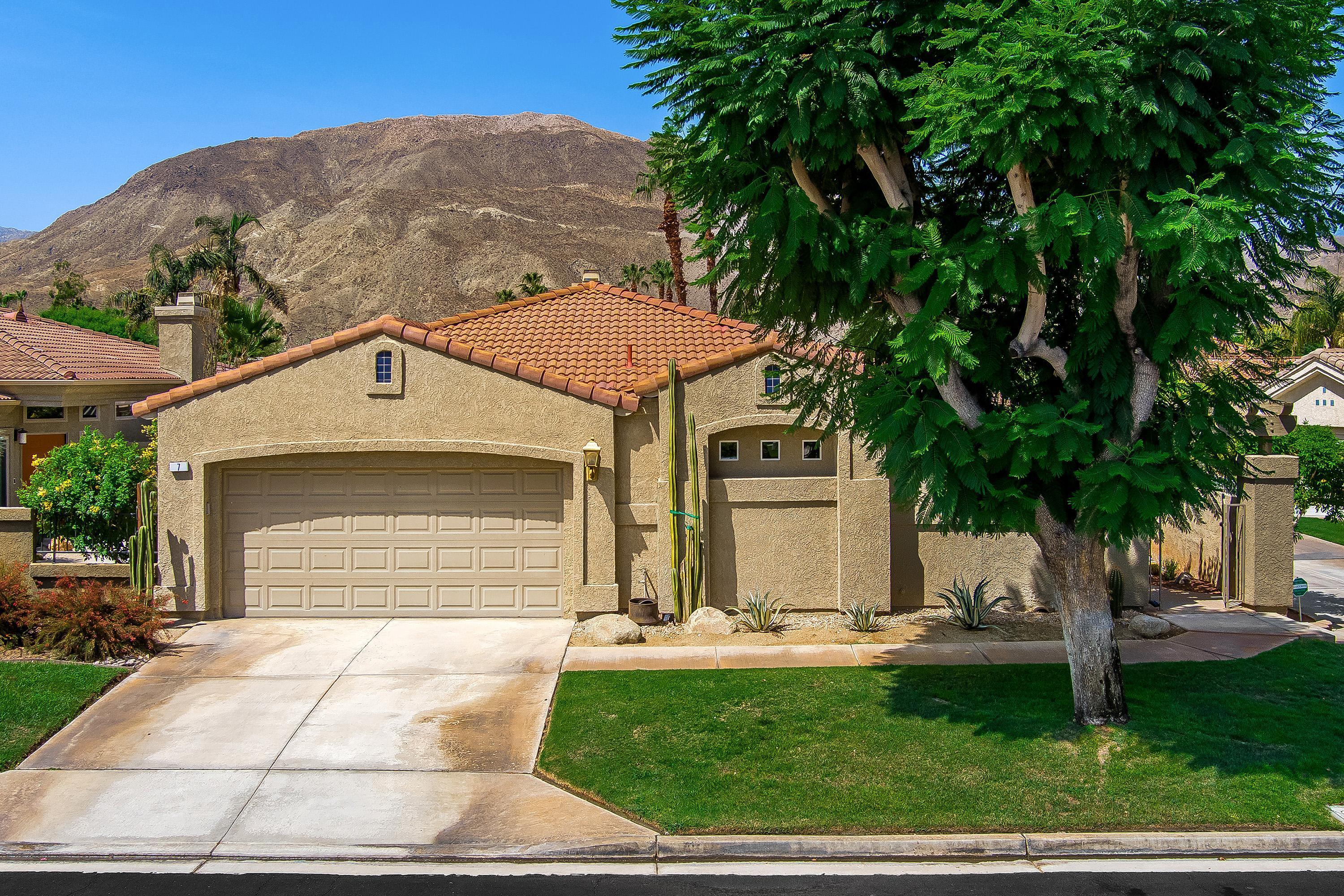7 Florentina Drive Rancho Mirage, CA 92270 - Photo 27 of 45 a front view of a house with a yard