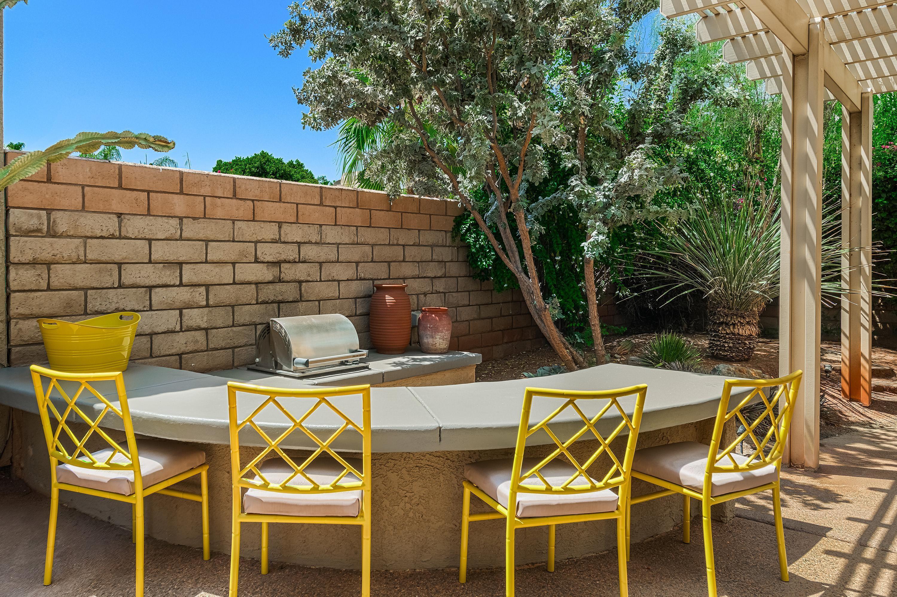 7 Florentina Drive Rancho Mirage, CA 92270 - Photo 34 of 45 a patio with table and chairs