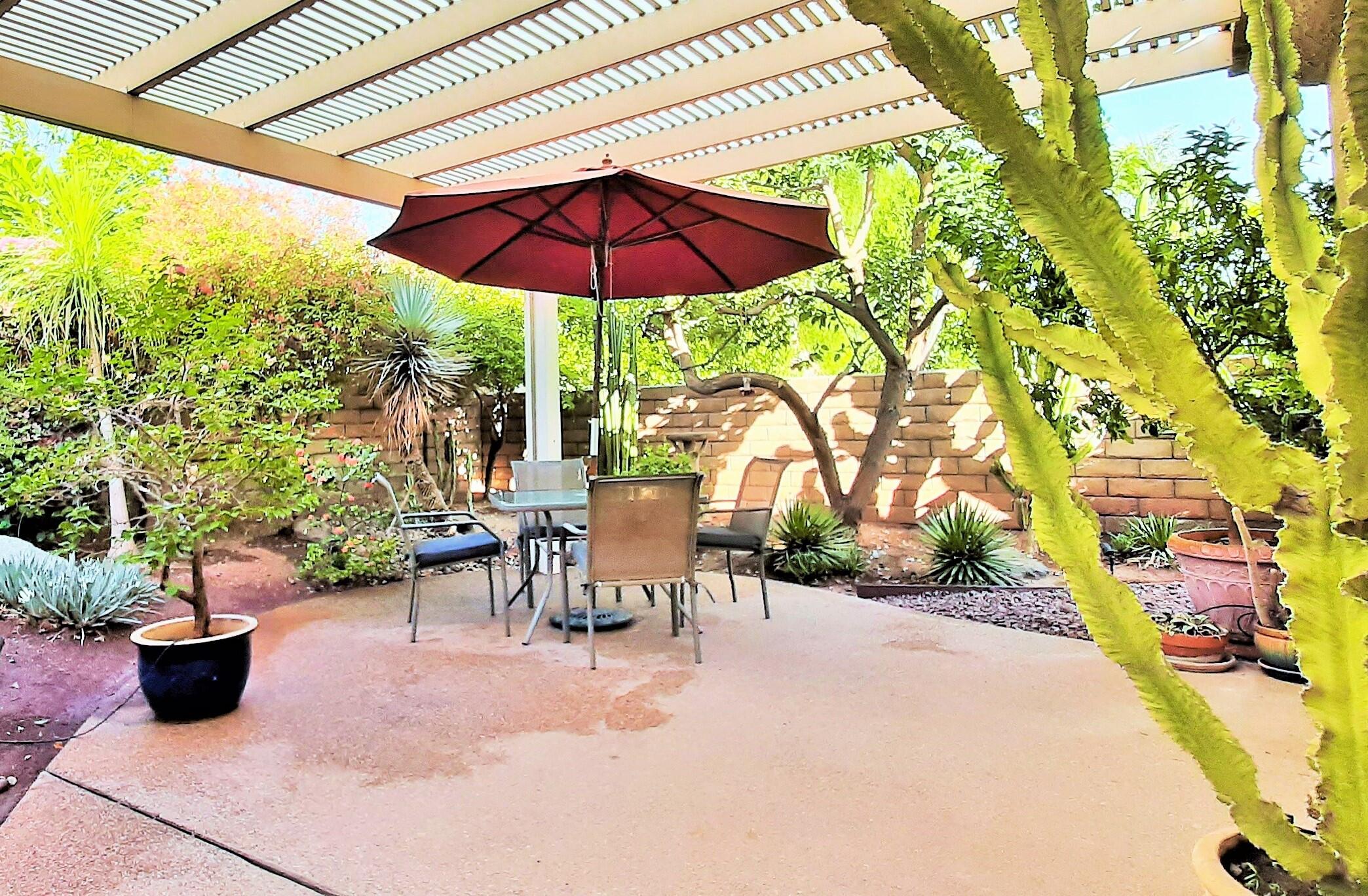7 Florentina Drive Rancho Mirage, CA 92270 - Photo 5 of 45 a view of a patio with plants and chairs