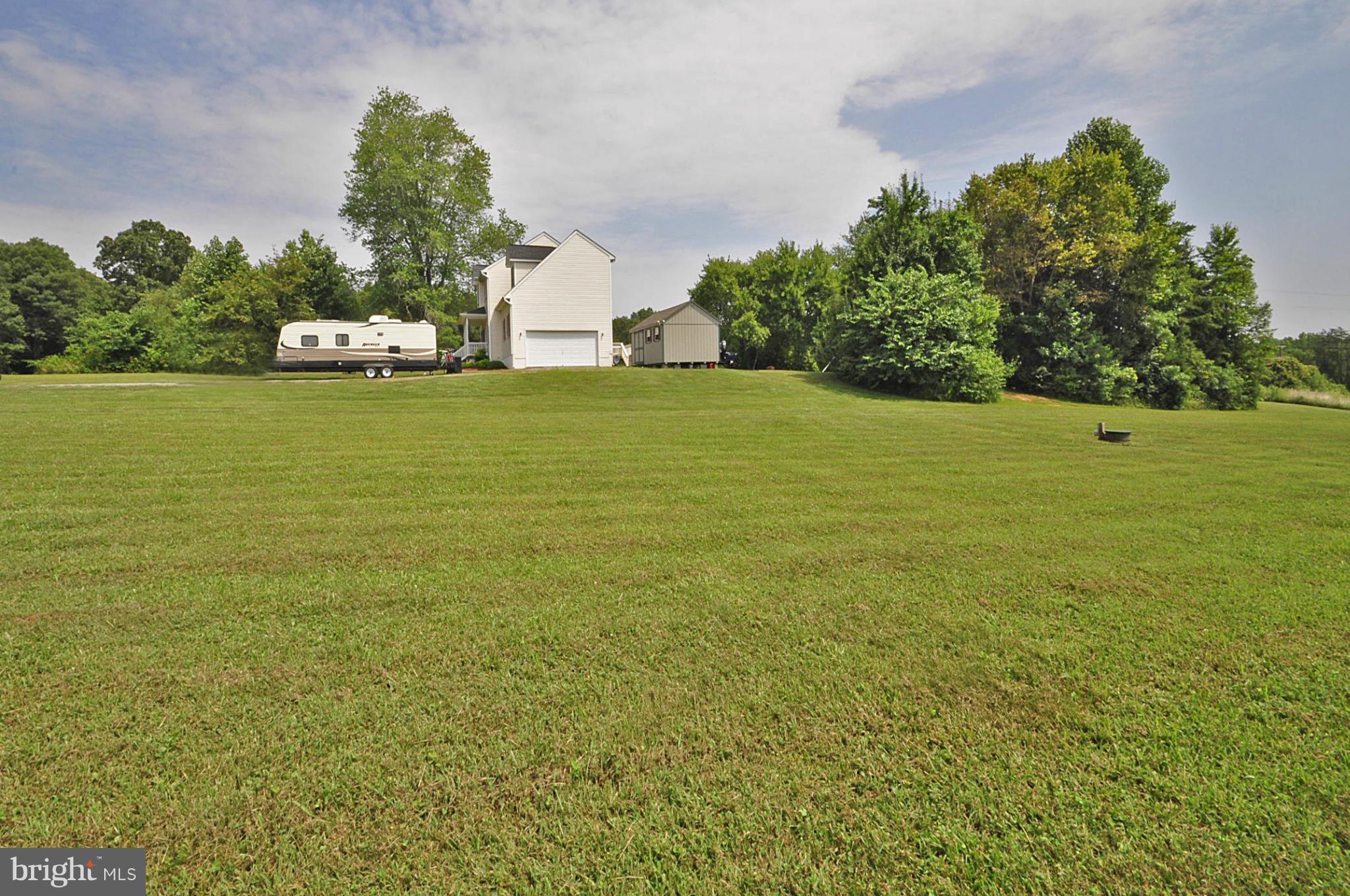 4625 Lewiston Road Bumpass, VA 23024 - Photo 8 of 30 a tall yard with lots of green space