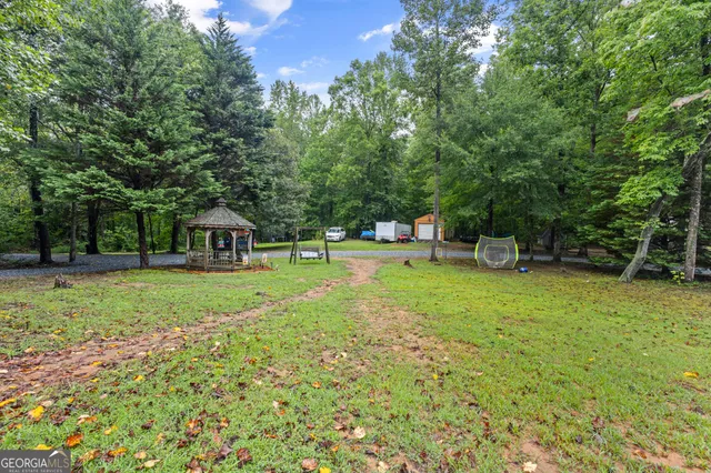 a view of a yard with a tree
