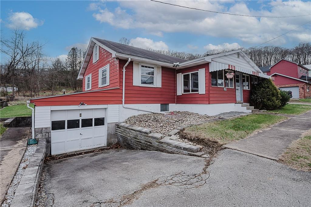 28 Indiana Avenue Avonmore, PA 15618 - Photo 13 of 49 a front view of a house with a garden