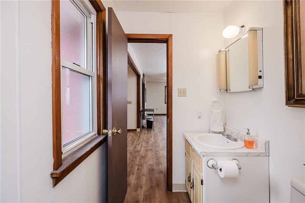 28 Indiana Avenue Avonmore, PA 15618 - Photo 20 of 49 a bathroom with a double vanity sink and a mirror
