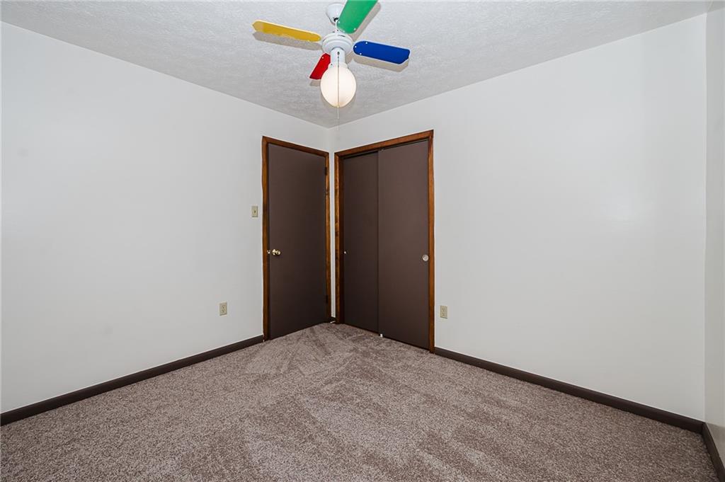 28 Indiana Avenue Avonmore, PA 15618 - Photo 24 of 49 an empty room with window and ceiling fan