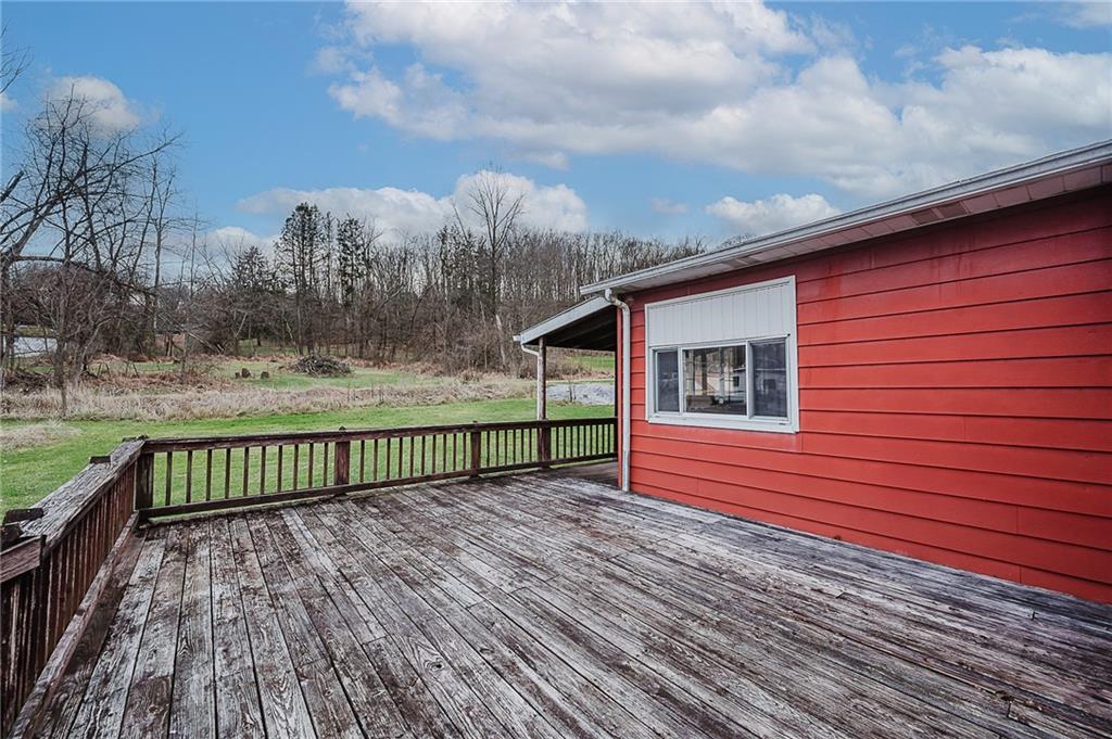 28 Indiana Avenue Avonmore, PA 15618 - Photo 32 of 49 a view of a wooden deck with a yard